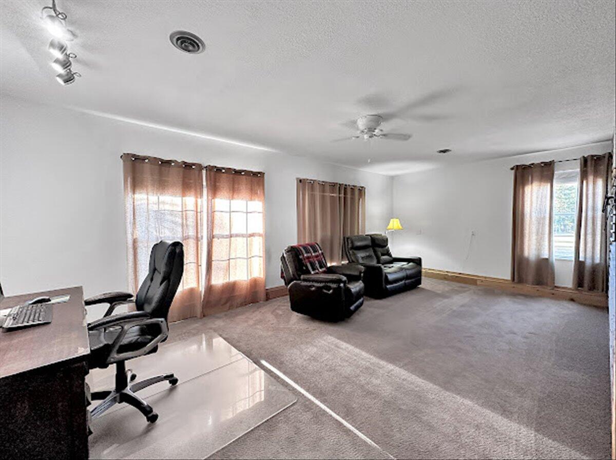 208 Hinote Road DeFuniak Springs, FL 32433 - Photo 26 of 49 a view of a livingroom with workspace and a window