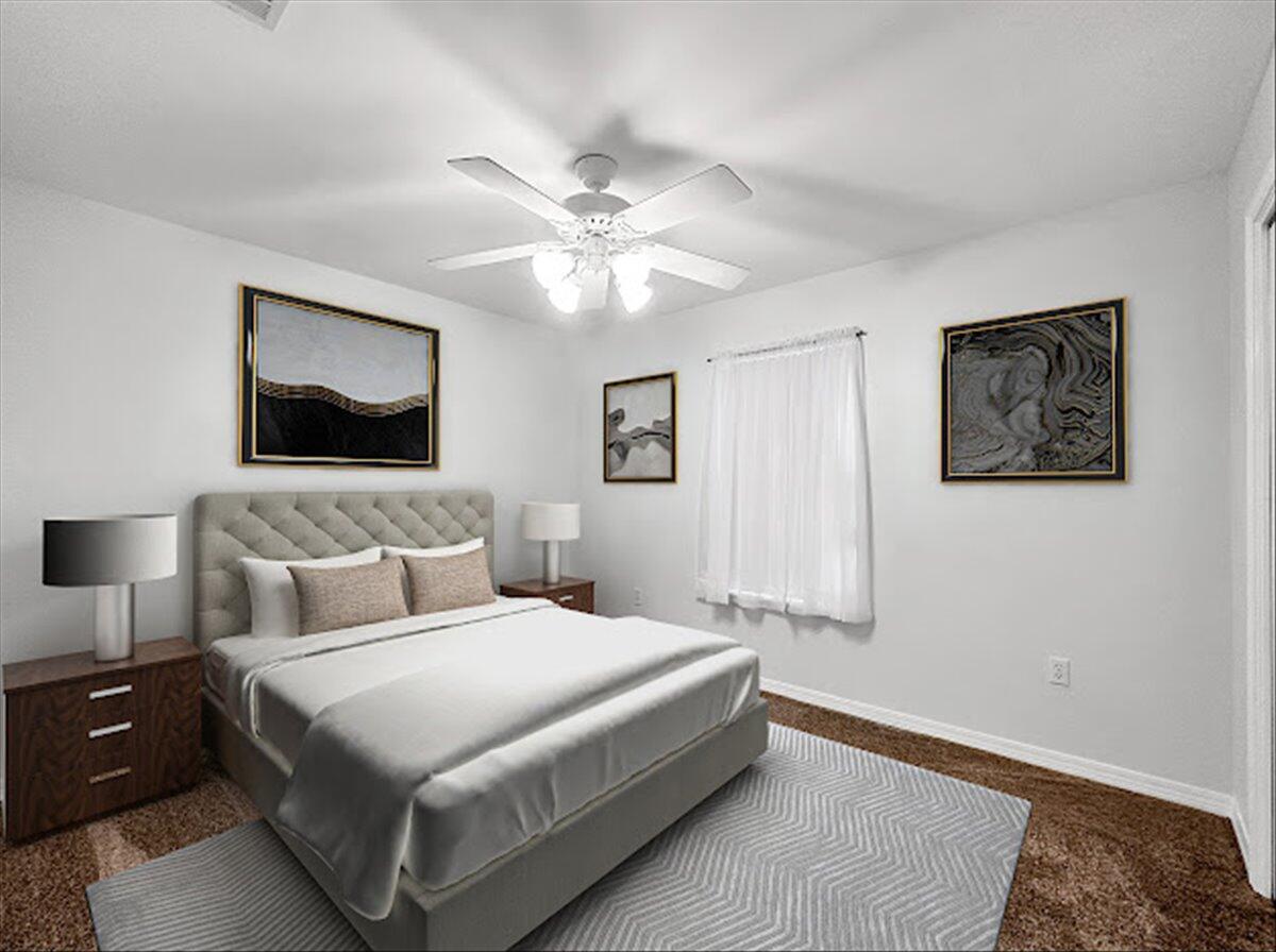 208 Hinote Road DeFuniak Springs, FL 32433 - Photo 35 of 49 a bedroom with a large bed and a chandelier