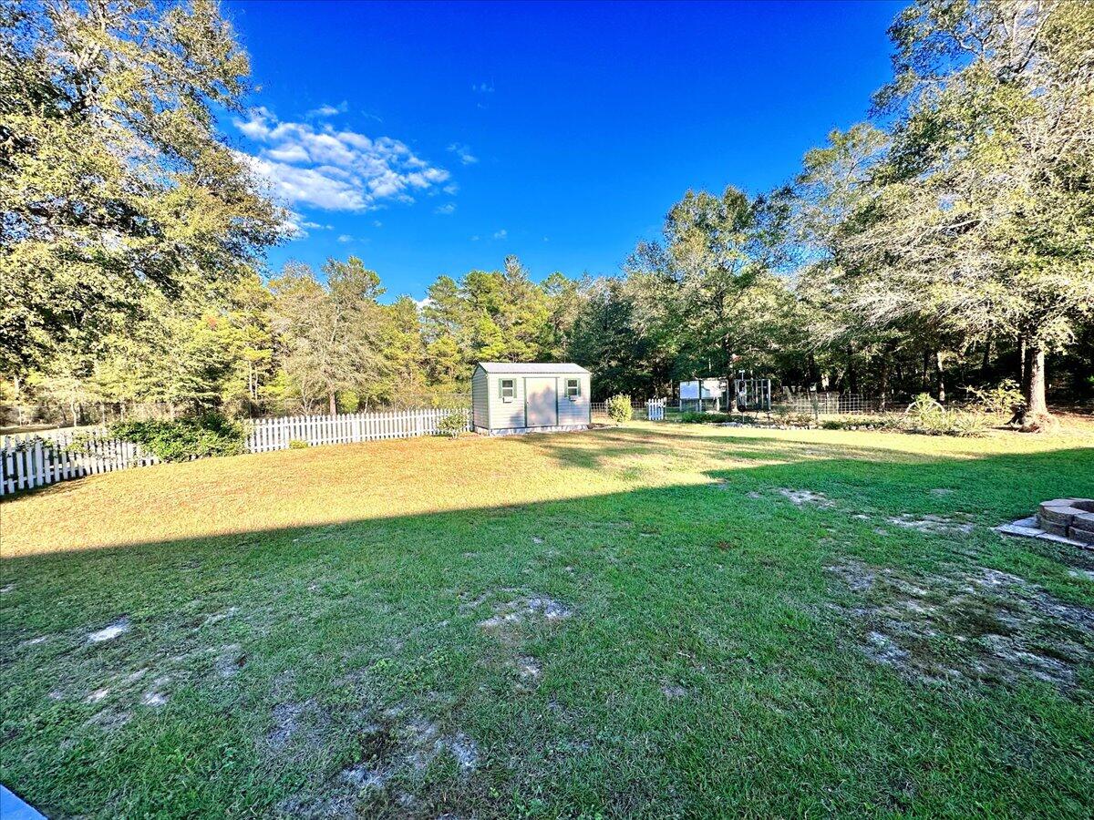 208 Hinote Road DeFuniak Springs, FL 32433 - Photo 39 of 49 a view of swimming pool with an outdoor space and seating area