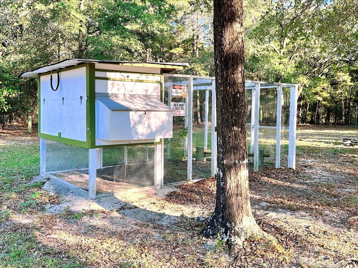 208 Hinote Road DeFuniak Springs, FL 32433 - Photo 41 of 49 a front view of a house with a yard