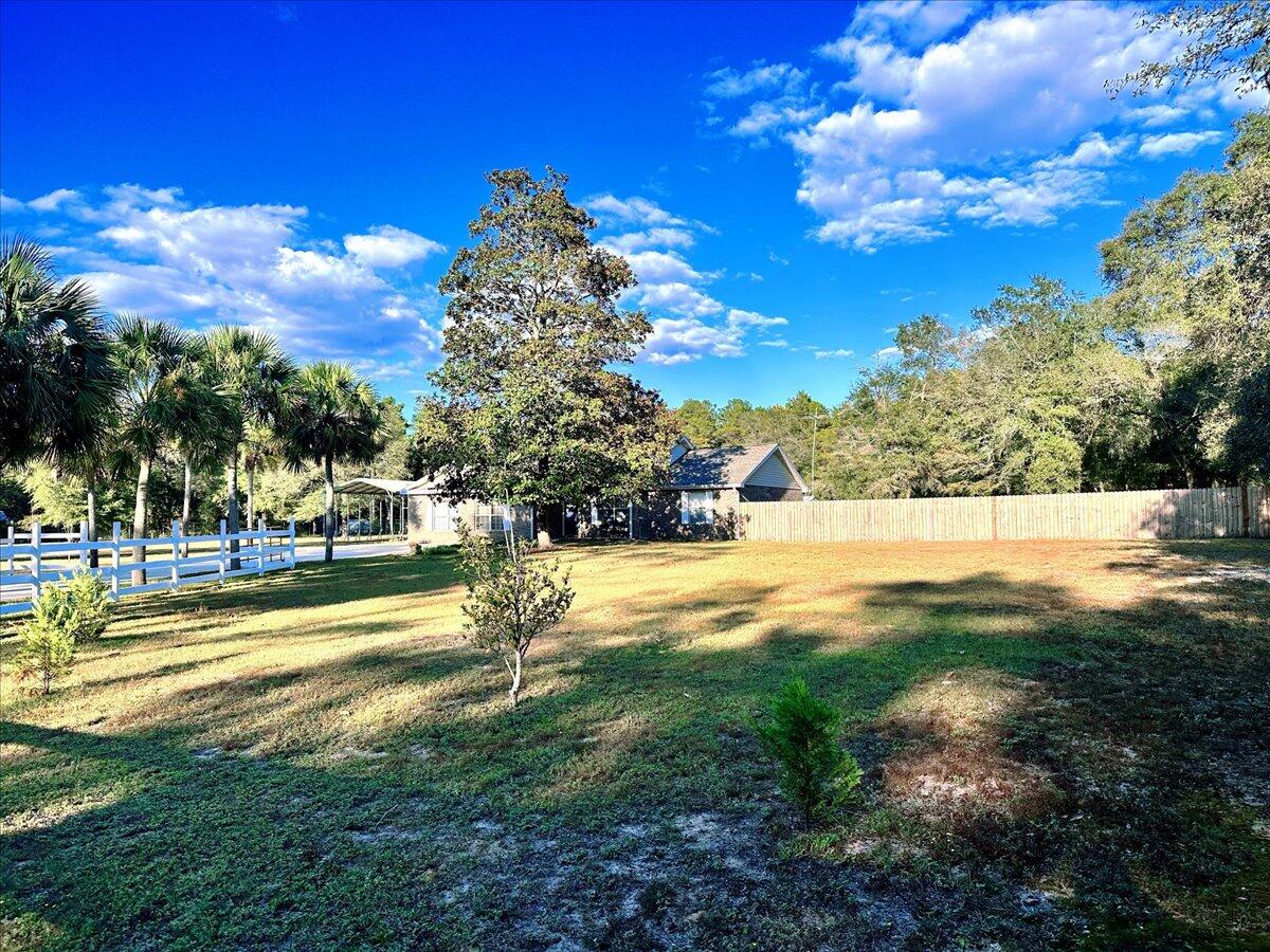 208 Hinote Road DeFuniak Springs, FL 32433 - Photo 43 of 49 a view of yard with swimming pool and green space