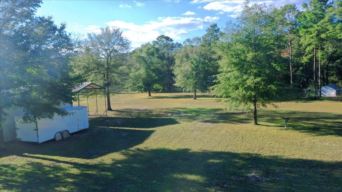 208 Hinote Road DeFuniak Springs, FL 32433 - Photo 44 of 49 a view of a yard with basketball court