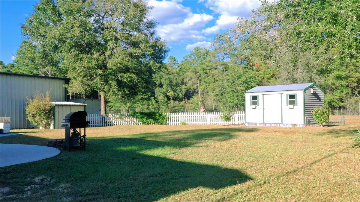 208 Hinote Road DeFuniak Springs, FL 32433 - Photo 45 of 49 a view of a house with backyard and a tree
