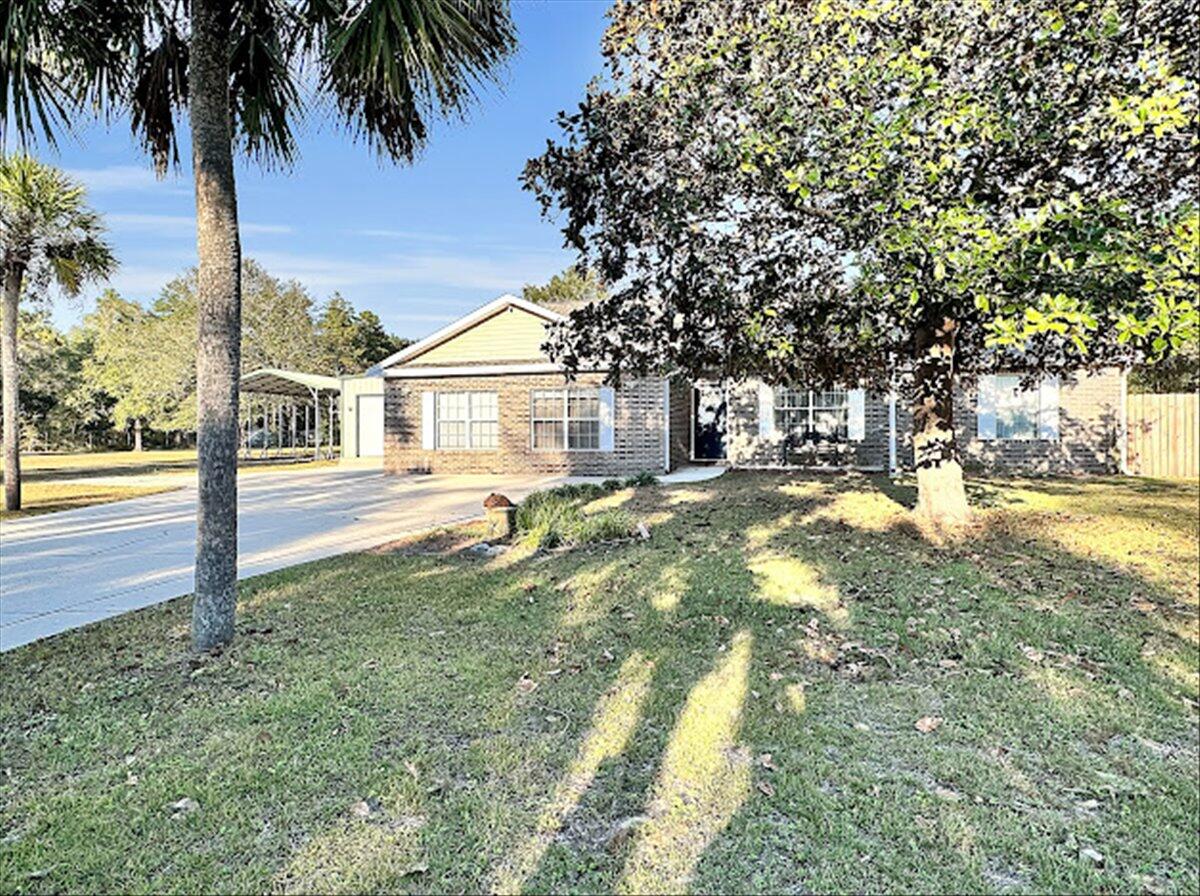 208 Hinote Road DeFuniak Springs, FL 32433 - Photo 5 of 49 a view of yard with palm trees