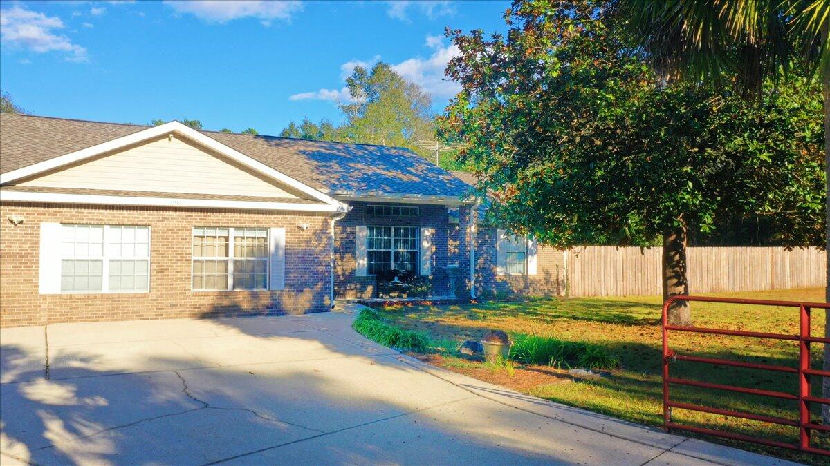 208 Hinote Road DeFuniak Springs, FL 32433 - Photo 7 of 49 a view of a house with sitting area and garden