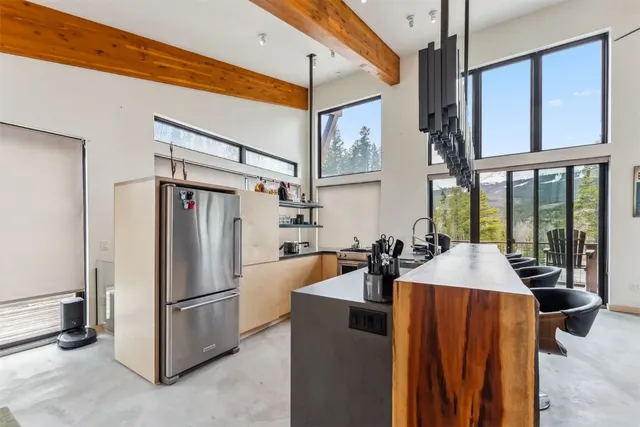 a kitchen with stainless steel appliances a stove and a sink