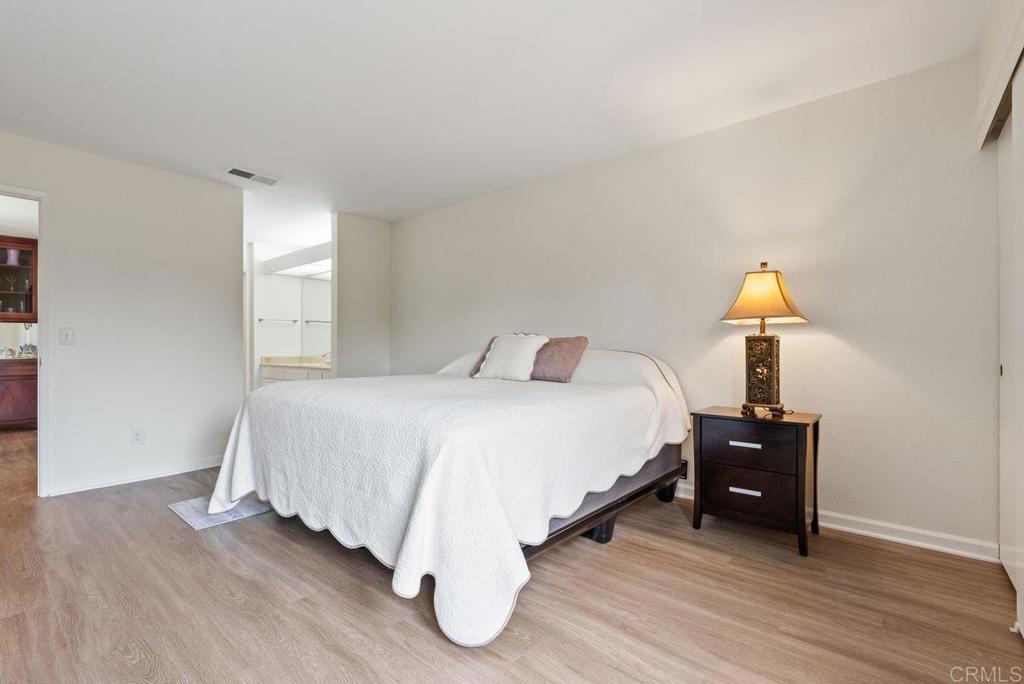 17607 Pomerado Road, Unit 101 San Diego, CA 92128 - Photo 16 of 39 a bedroom with a bed and a window