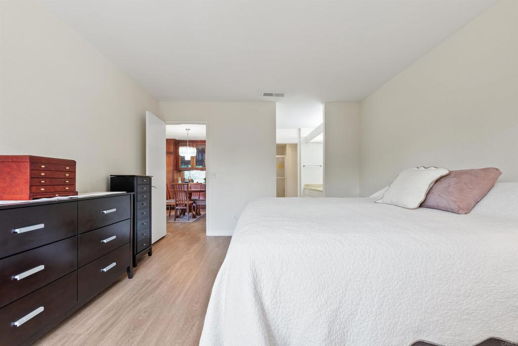17607 Pomerado Road, Unit 101 San Diego, CA 92128 - Photo 18 of 39 a bedroom with a bed and a dresser