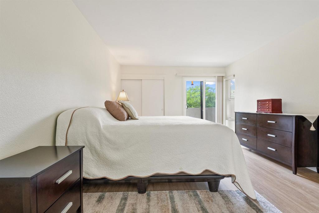 17607 Pomerado Road, Unit 101 San Diego, CA 92128 - Photo 20 of 39 a bedroom with a bed and a window