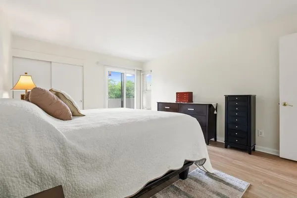a bedroom with a bed and a tv