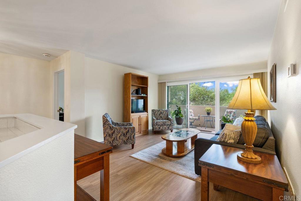 17607 Pomerado Road, Unit 101 San Diego, CA 92128 - Photo 5 of 39 a living room with furniture and a large window
