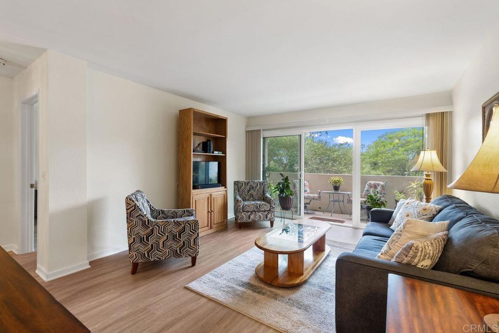 17607 Pomerado Road, Unit 101 San Diego, CA 92128 - Photo 6 of 39 a living room with furniture and a large window