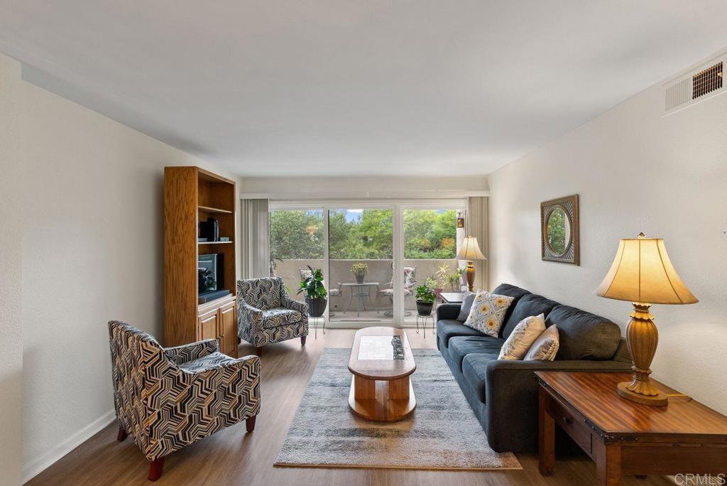 17607 Pomerado Road, Unit 101 San Diego, CA 92128 - Photo 7 of 39 a living room with furniture and a lamp