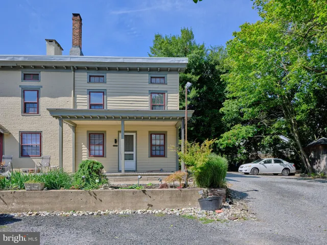 a front view of a house with yard