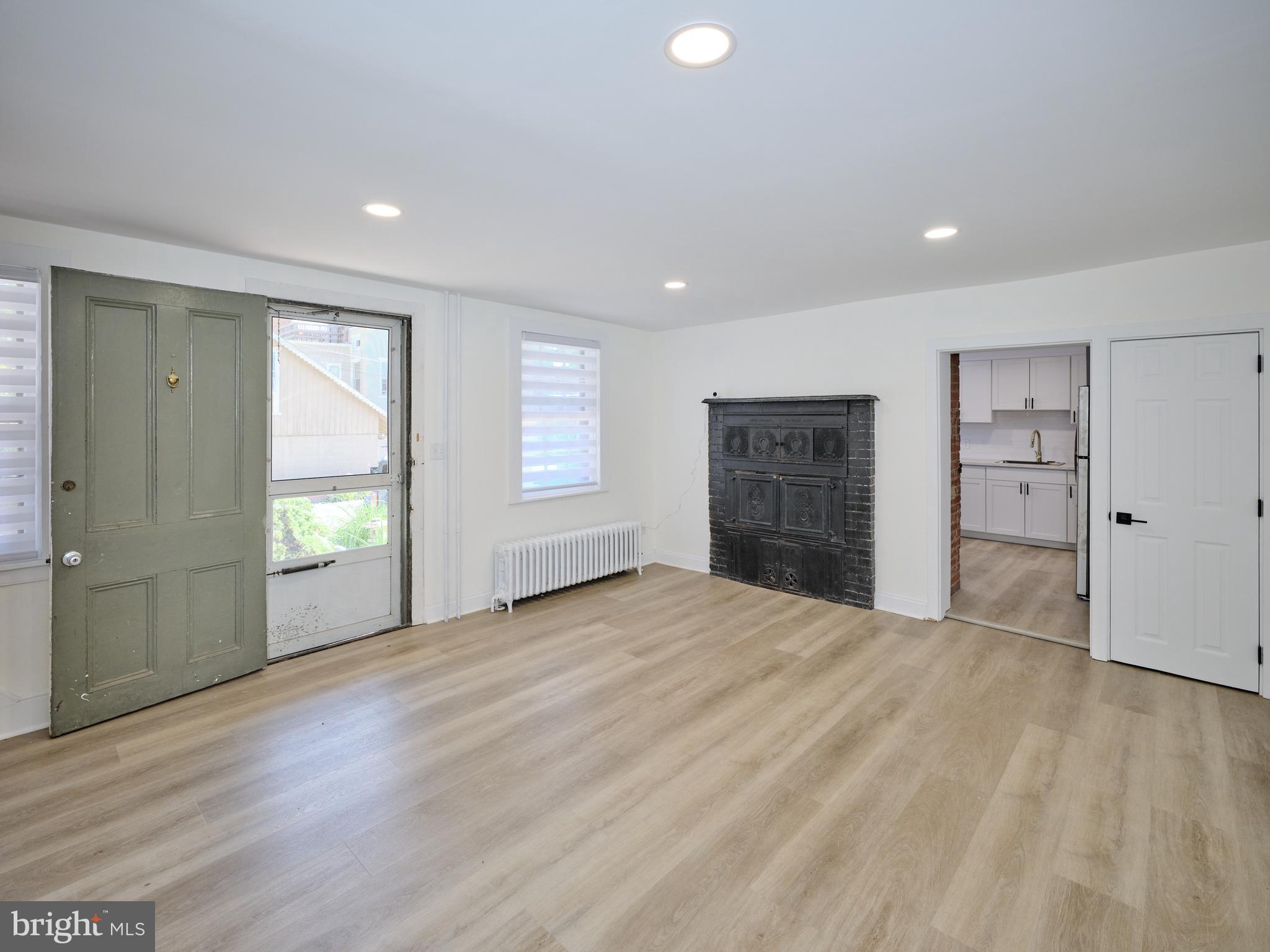 14 West Bridge Street, Unit A New Hope, PA 18938 - Photo 5 of 20 a view of an empty room with a window and a kitchen