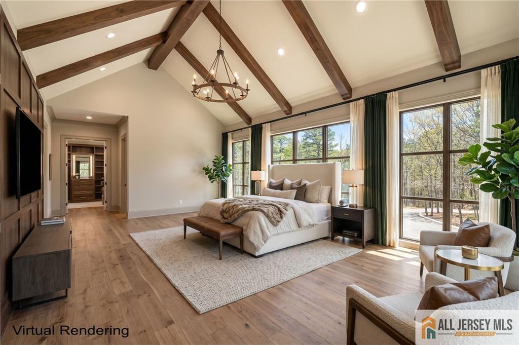 381 Monmouth Road Freehold, NJ 07728 - Photo 57 of 63 a spacious bedroom with a bed and wooden floor