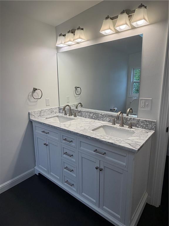 11753 Oakview Road Conneaut Lake, PA 16316 - Photo 25 of 34 a bathroom with a granite countertop sink and a mirror