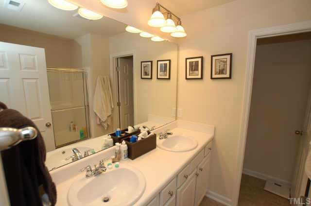 7038 Racine Way Raleigh, NC 27615 - Photo 11 of 12 Master bath has double bowl vanities, seperate water closet and garden tub/shower. Other