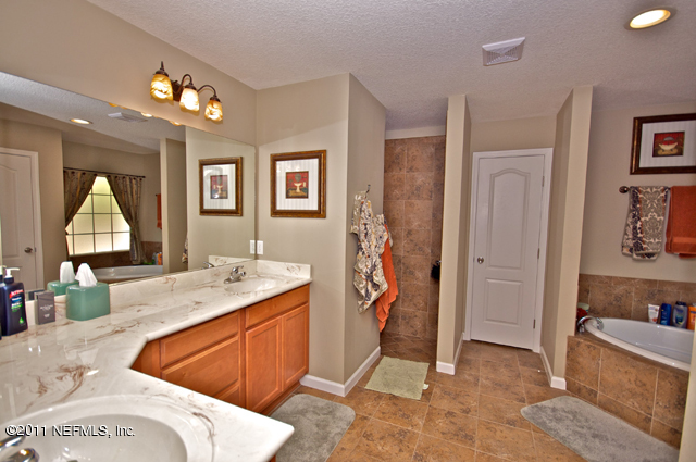 3276 Gay Road Orange Park, FL 32065 - Photo 13 of 21 a spacious bathroom with a granite countertop sink and a mirror