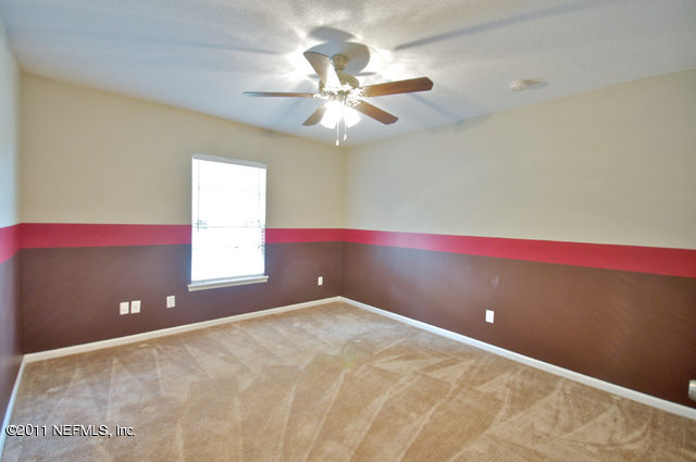 3276 Gay Road Orange Park, FL 32065 - Photo 17 of 21 an empty room with windows and fan