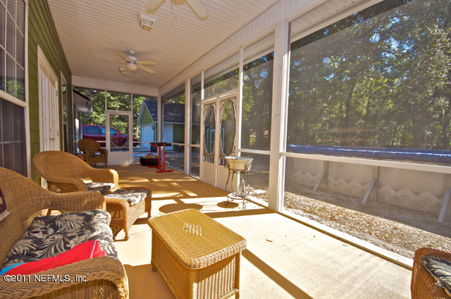 3276 Gay Road Orange Park, FL 32065 - Photo 19 of 21 a outdoor space with patio the couches and a dining table with the view of the balcony