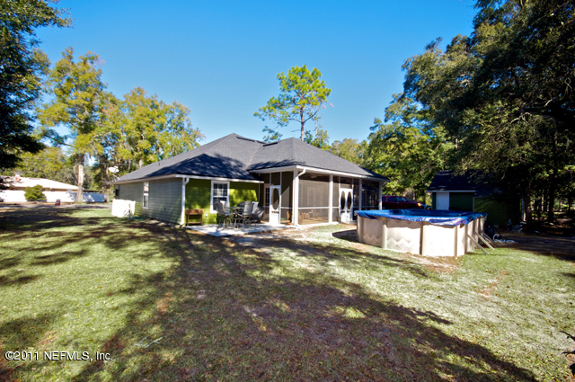 3276 Gay Road Orange Park, FL 32065 - Photo 20 of 21 a view of a house with swimming pool and sitting area