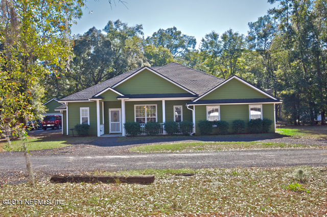 3276 Gay Road Orange Park, FL 32065 - Photo 4 of 21 a front view of a house with a yard
