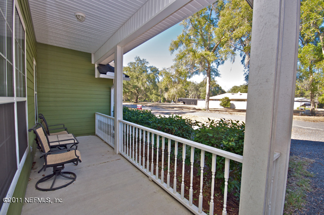 3276 Gay Road Orange Park, FL 32065 - Photo 5 of 21 a view of a chair and table in patio with a yard