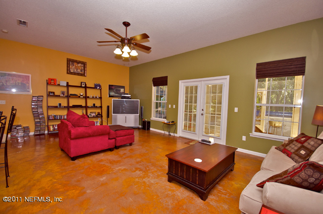 3276 Gay Road Orange Park, FL 32065 - Photo 8 of 21 a living room with furniture gym equipment and a window