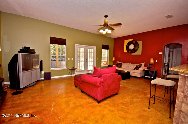 3276 Gay Road Orange Park, FL 32065 - Photo 9 of 21 a living room with furniture and a flat screen tv