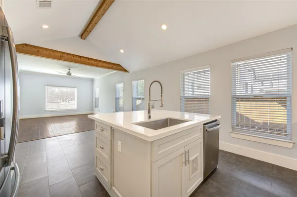 a kitchen with a sink and a window