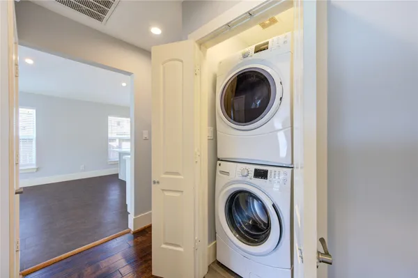 a view of a hallway with washer and dryer
