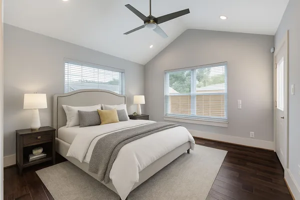 a bed room with a bed and a window