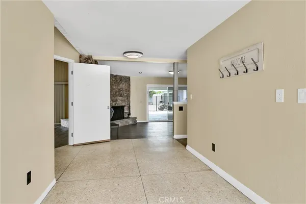 a kitchen with stainless steel appliances granite countertop white cabinets granite counter tops and a window
