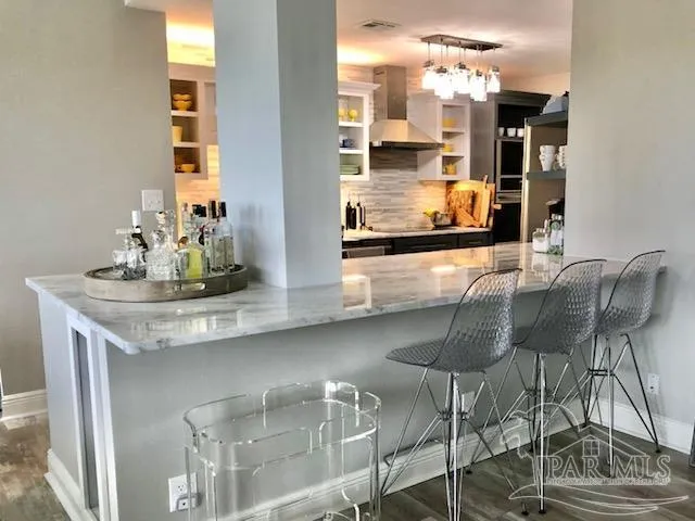 a kitchen with a table and chairs in it