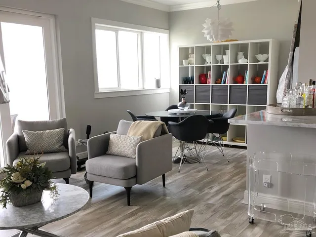 a living room with furniture and a potted plant