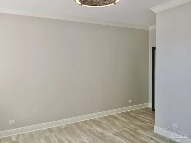 a bathroom with a granite countertop toilet sink and mirror