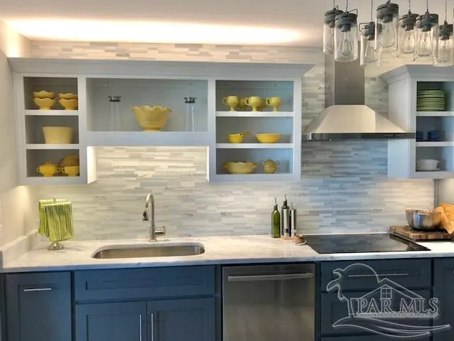 a kitchen with a sink and cabinets
