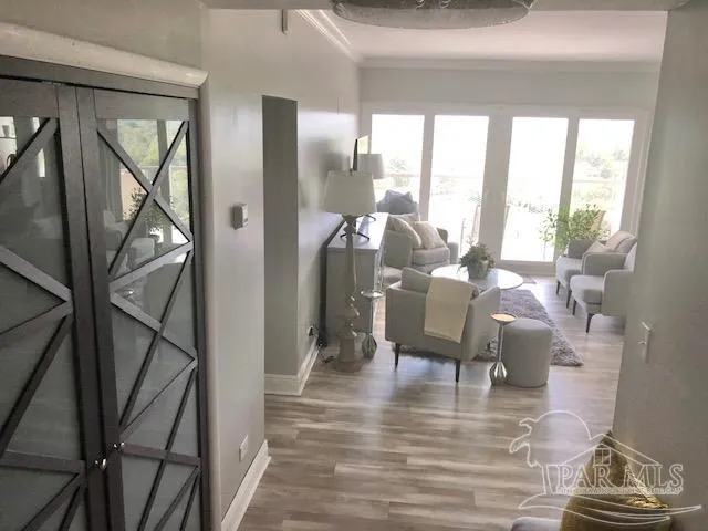 a view of a livingroom with furniture and hardwood floor