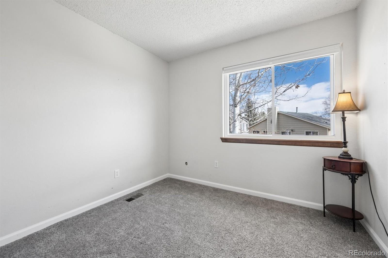 9802 Garrison Court Westminster, CO 80021 - Photo 16 of 34 a view of wall with painting on the wall