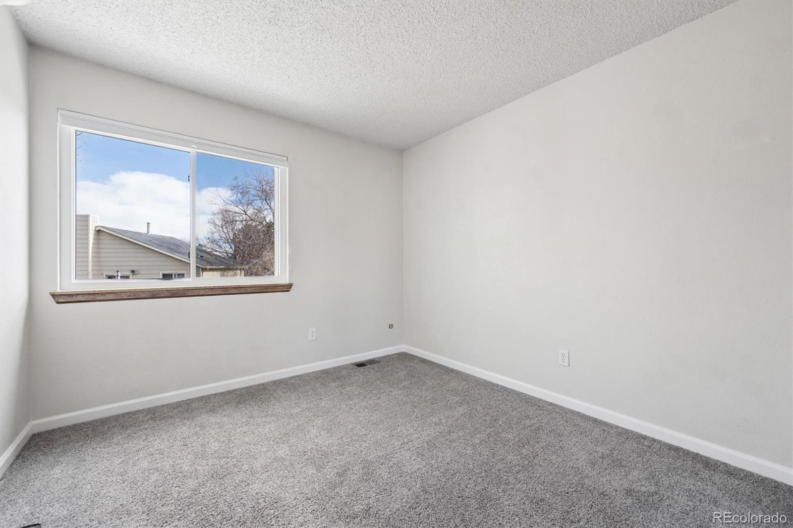 9802 Garrison Court Westminster, CO 80021 - Photo 19 of 34 an empty room with a window