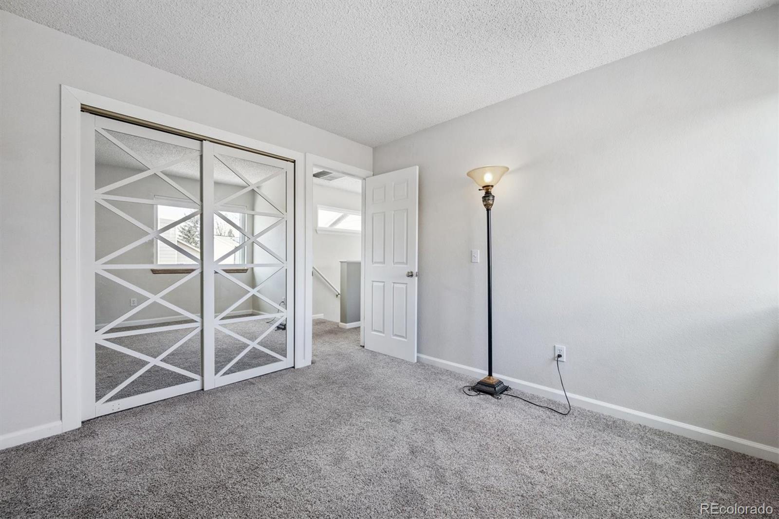 9802 Garrison Court Westminster, CO 80021 - Photo 20 of 34 an empty room with windows