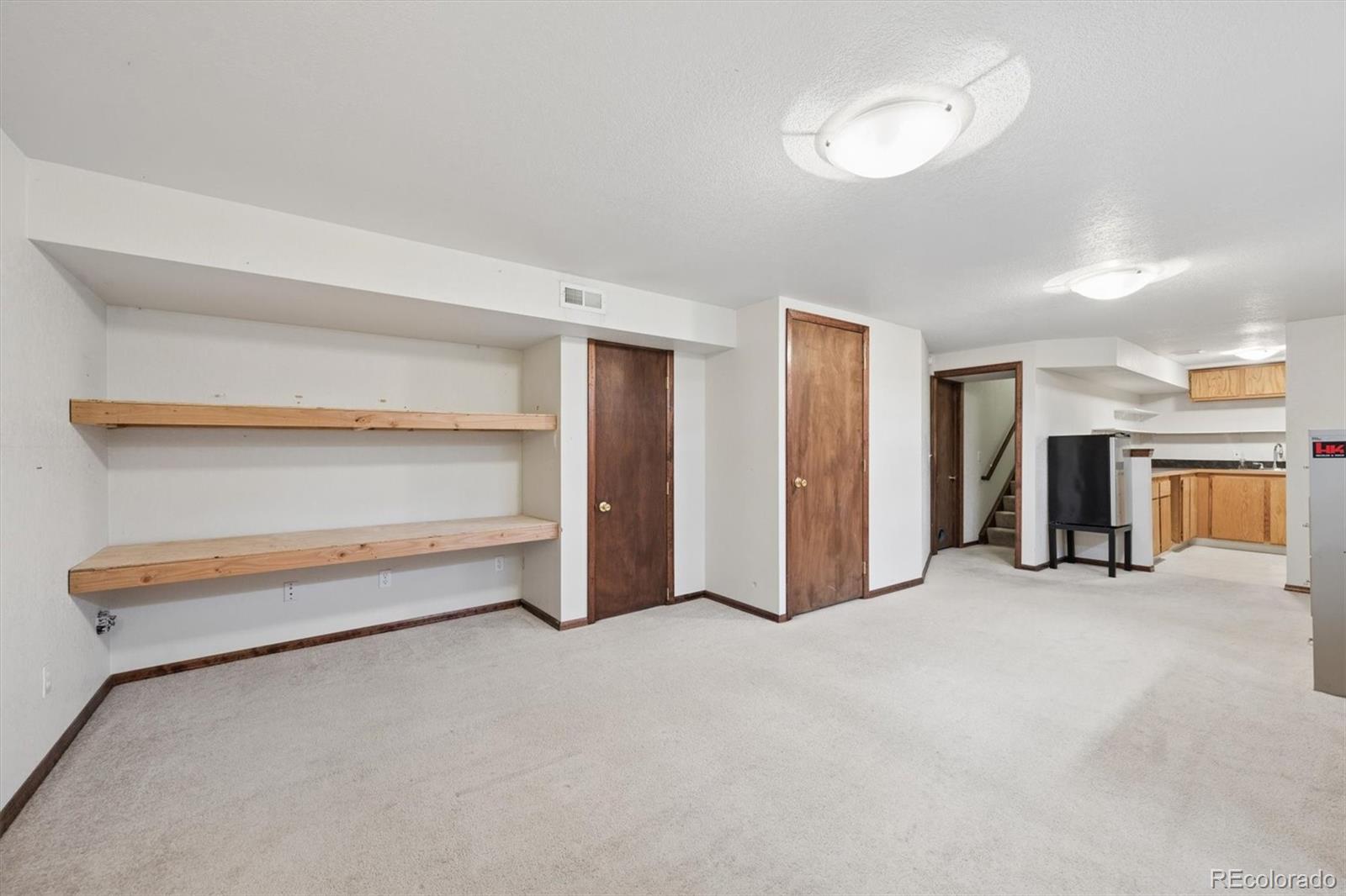 9802 Garrison Court Westminster, CO 80021 - Photo 27 of 34 a view of an empty room with closet and a window
