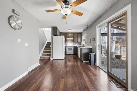 a view of kitchen with sink and wooden floor