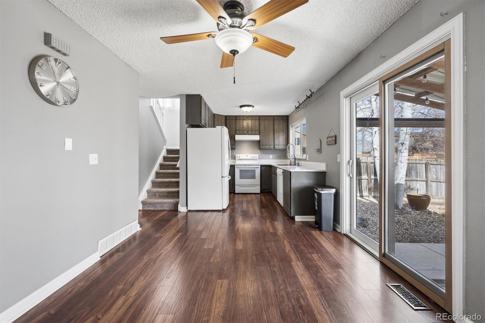 9802 Garrison Court Westminster, CO 80021 - Photo 9 of 34 a view of kitchen with sink and wooden floor