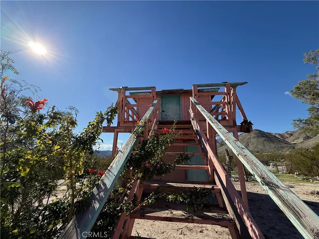 a view of a patio with chair and tables