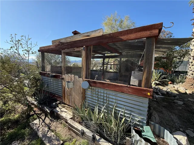 a roof deck with table and chairs