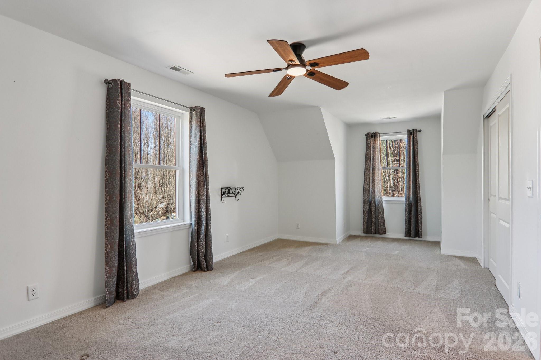 751 Hutch Mountain Road Fletcher, NC 28732 - Photo 33 of 48 a view of a livingroom with a ceiling fan and window