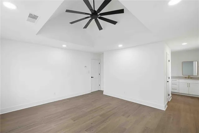 a view of a kitchen with a sink and a stove