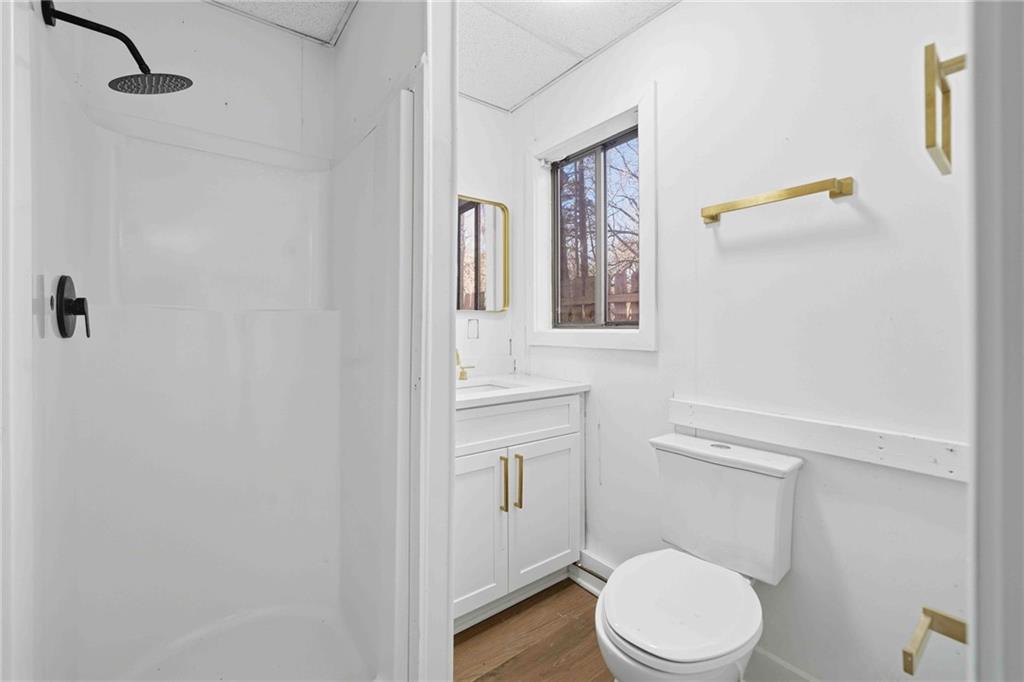 8975 Martin Road Roswell, GA 30076 - Photo 17 of 32 a white toilet sitting next to a bathroom sink